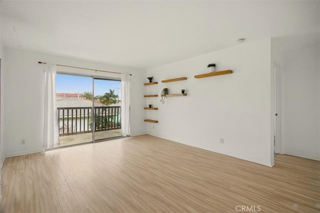4727 W 147th St Unit 133, Lawndale, CA 90260 - spare room featuring light wood-type flooring and a smoke detector