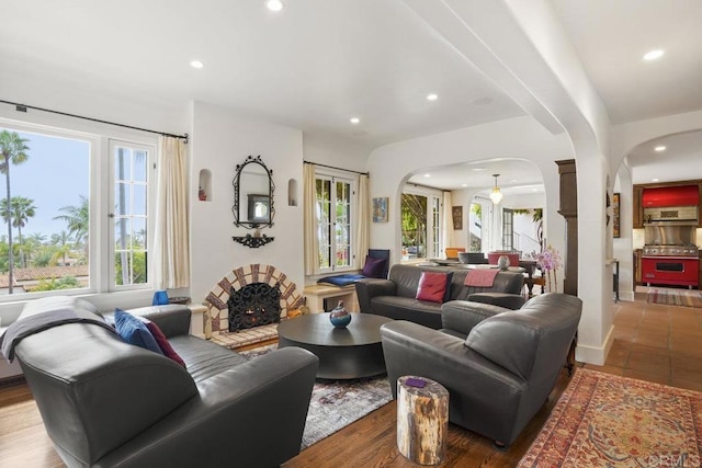 308 Sunset Dr Unit A, Encinitas, CA 92024 - living room with arched walkways, recessed lighting, and plenty of natural light