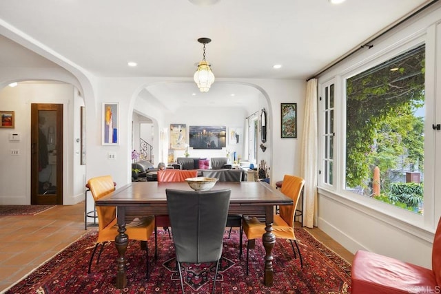 308 Sunset Dr Unit A, Encinitas, CA 92024 - tiled dining area featuring arched walkways and recessed lighting
