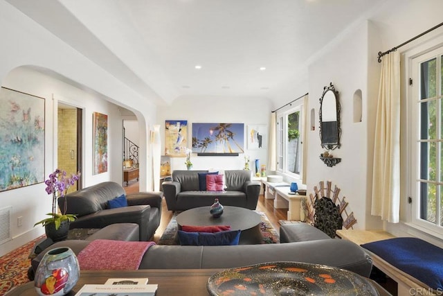 308 Sunset Dr Unit A, Encinitas, CA 92024 - living room with arched walkways, wood finished floors, and recessed lighting