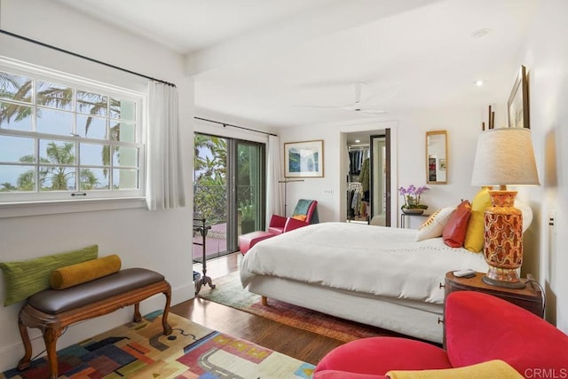 308 Sunset Dr Unit A, Encinitas, CA 92024 - bedroom with access to outside, wood finished floors, a spacious closet, a closet, and ceiling fan