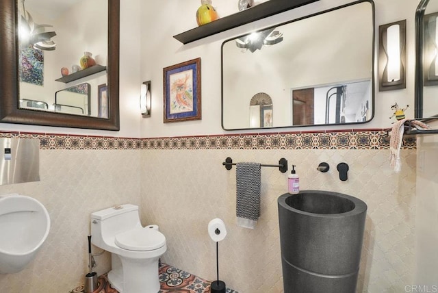 308 Sunset Dr Unit A, Encinitas, CA 92024 - half bath with tile walls and a wainscoted wall