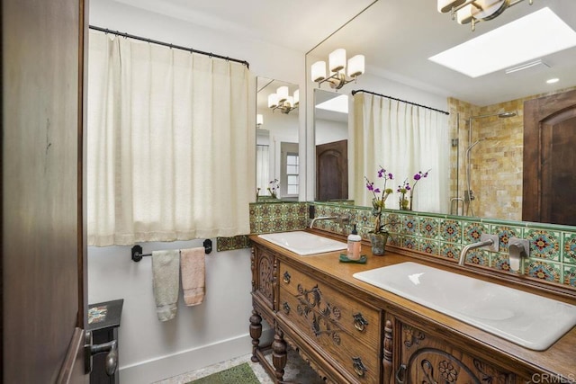 308 Sunset Dr Unit A, Encinitas, CA 92024 - bathroom featuring double vanity and a tile shower