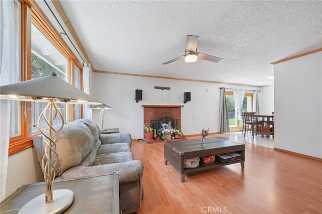 18472 Dragonera Dr, Rowland Heights, CA 91748 - living area featuring a textured ceiling, ceiling fan, wood finished floors, crown molding, and a fireplace