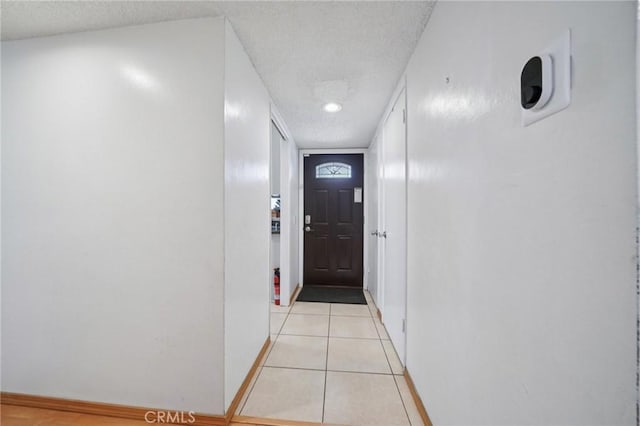 18472 Dragonera Dr, Rowland Heights, CA 91748 - doorway to outside with a textured ceiling and light tile patterned floors
