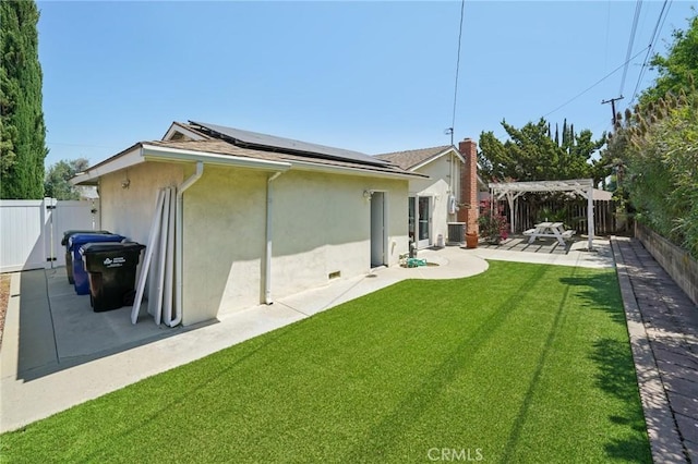 18472 Dragonera Dr, Rowland Heights, CA 91748 - rear view of property featuring stucco siding, solar panels, a pergola, and a fenced backyard