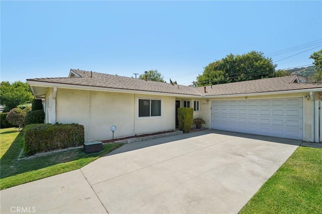 18472 Dragonera Dr, Rowland Heights, CA 91748 - ranch-style home with concrete driveway, a garage, stucco siding, and a front yard