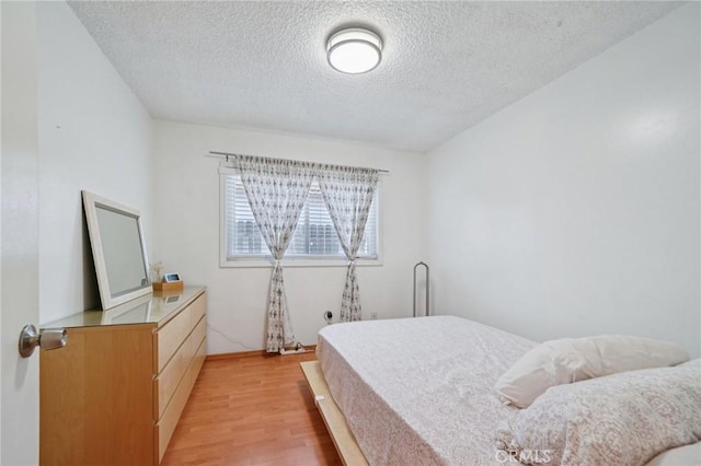 18472 Dragonera Dr, Rowland Heights, CA 91748 - bedroom with a textured ceiling and light wood finished floors