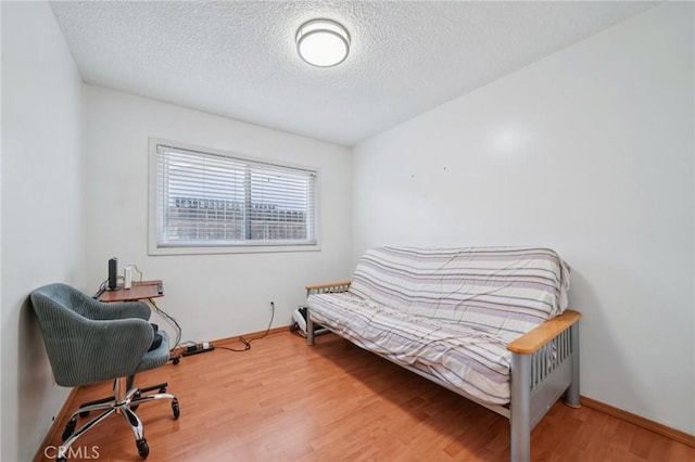 18472 Dragonera Dr, Rowland Heights, CA 91748 - bedroom featuring a textured ceiling and wood finished floors
