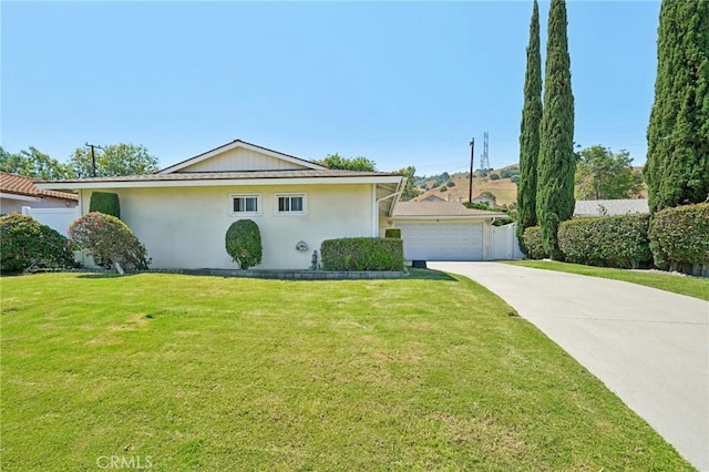 18472 Dragonera Dr, Rowland Heights, CA 91748 - view of front of property with a front lawn, stucco siding, and a detached garage