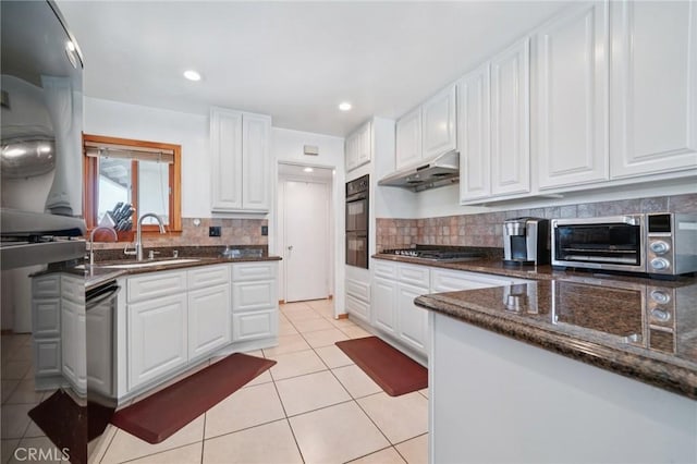 18472 Dragonera Dr, Rowland Heights, CA 91748 - kitchen featuring appliances with stainless steel finishes, under cabinet range hood, backsplash, white cabinets, and recessed lighting
