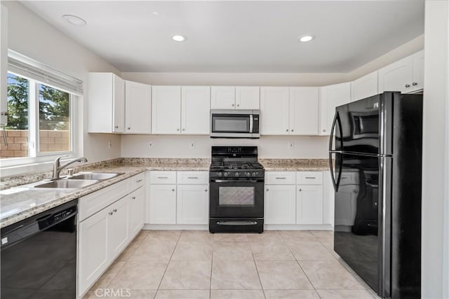 45722 Palm Ln, Lancaster, CA 93535 - kitchen featuring black appliances, white cabinetry, light stone countertops, light tile patterned floors, and recessed lighting