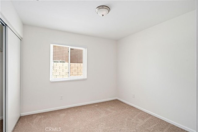 45722 Palm Ln, Lancaster, CA 93535 - unfurnished bedroom featuring light carpet and a closet