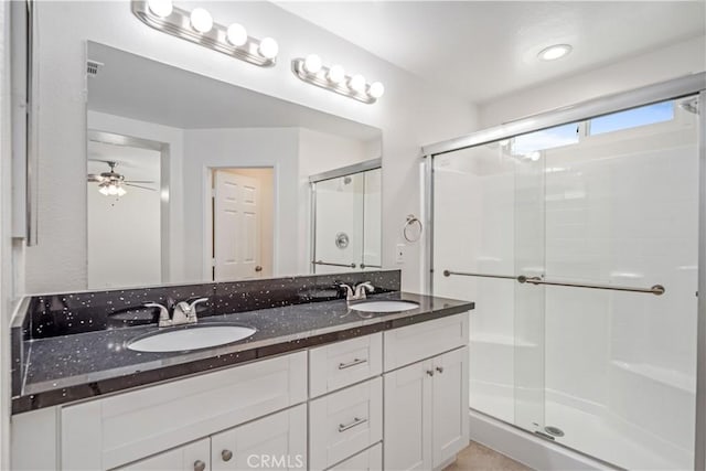 45722 Palm Ln, Lancaster, CA 93535 - full bathroom featuring double vanity, a stall shower, and ceiling fan
