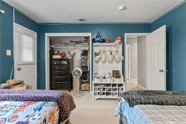 624 N Yucca Ave, Rialto, CA 92376 - bedroom with a closet and wood finished floors