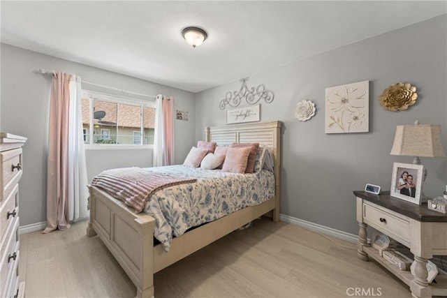 624 N Yucca Ave, Rialto, CA 92376 - bedroom featuring light wood-style flooring and baseboards