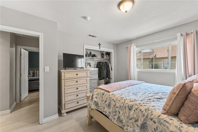 624 N Yucca Ave, Rialto, CA 92376 - bedroom with a closet and light wood finished floors
