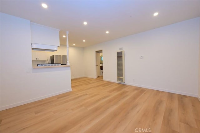 833 W Duarte Rd Unit 11, Arcadia, CA 91007 - spare room featuring a heating unit, recessed lighting, and light wood-style flooring