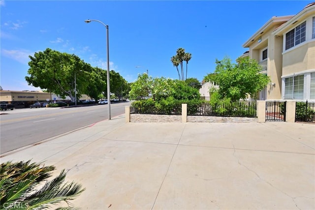 833 W Duarte Rd Unit 11, Arcadia, CA 91007 - view of asphalt road featuring sidewalks, street lights, and curbs