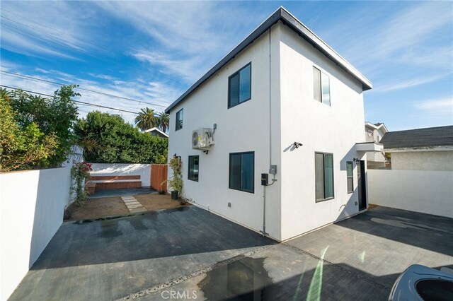 2342 S Cochran Ave, Los Angeles, CA 90016 - view of home's exterior with stucco siding and a patio area