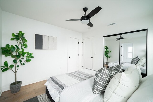 2342 S Cochran Ave, Los Angeles, CA 90016 - bedroom with wood finished floors and a ceiling fan