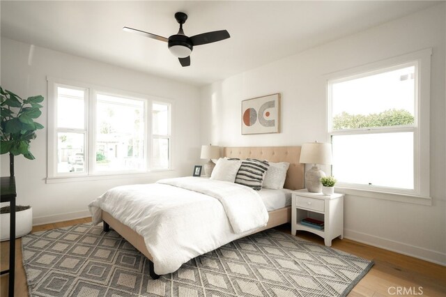 2342 S Cochran Ave, Los Angeles, CA 90016 - bedroom with wood finished floors and a ceiling fan