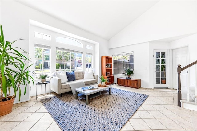 17 Indigo Pl, Aliso Viejo, CA 92656 - living area with light tile patterned flooring, high vaulted ceiling, and stairs