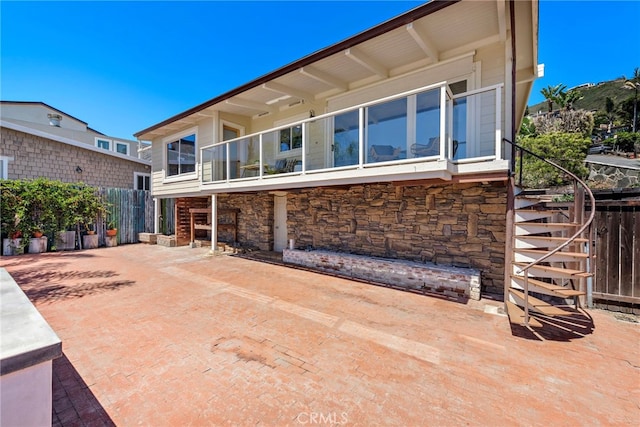32055 Virginia Way, Laguna Beach, CA 92651 - back of property with stone siding, stairs, and a patio area