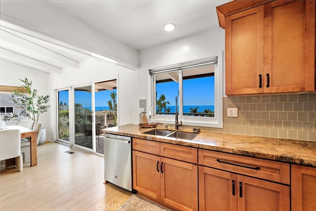 32055 Virginia Way, Laguna Beach, CA 92651 - kitchen with dishwasher, tasteful backsplash, light wood-style floors, light stone counters, and brown cabinets