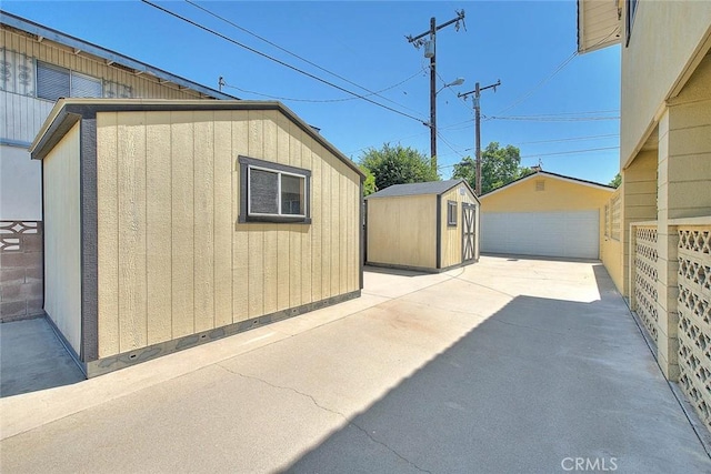 9465 Palo Verde Ave, Fontana, CA 92335 - view of patio / terrace featuring a detached garage and a storage unit
