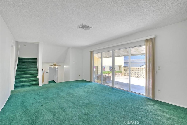 9465 Palo Verde Ave, Fontana, CA 92335 - empty room featuring carpet floors, a textured ceiling, stairway, and a ceiling fan