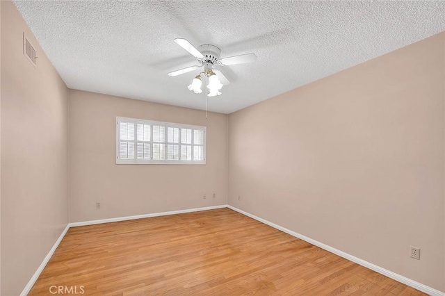 9465 Palo Verde Ave, Fontana, CA 92335 - unfurnished room featuring a textured ceiling, light wood-style flooring, and a ceiling fan