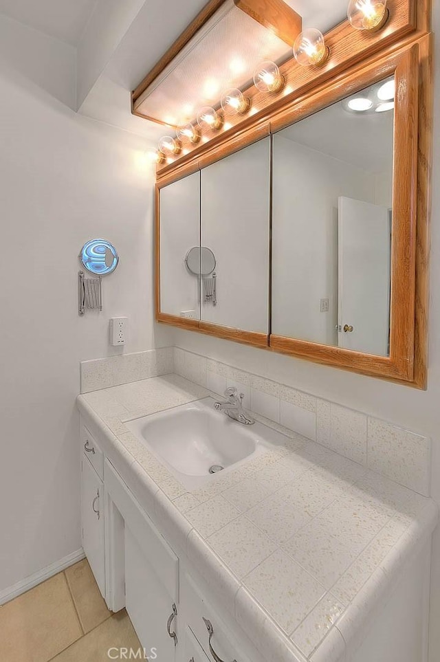 9465 Palo Verde Ave, Fontana, CA 92335 - bathroom featuring vanity and tile patterned flooring