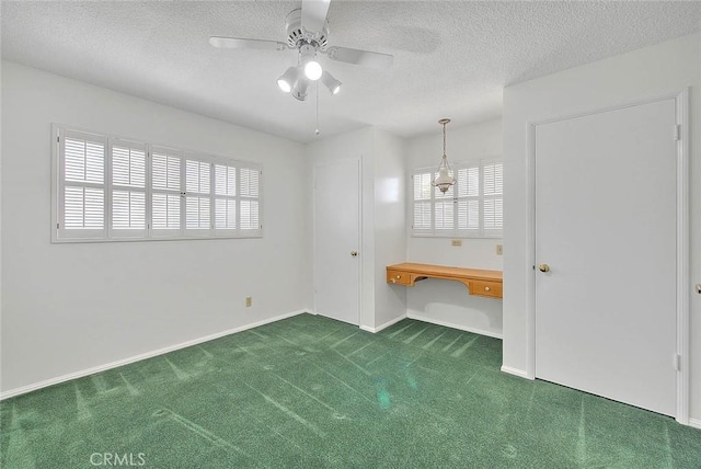 9465 Palo Verde Ave, Fontana, CA 92335 - unfurnished bedroom with carpet flooring, multiple windows, a textured ceiling, a ceiling fan, and a desk