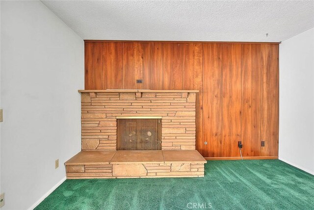 9465 Palo Verde Ave, Fontana, CA 92335 - unfurnished living room featuring carpet floors, wooden walls, and a textured ceiling