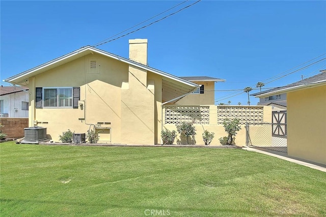 9465 Palo Verde Ave, Fontana, CA 92335 - rear view of house featuring stucco siding and a chimney