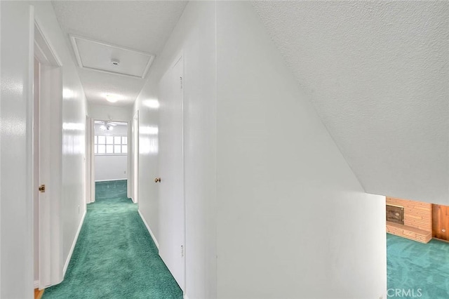 9465 Palo Verde Ave, Fontana, CA 92335 - hallway featuring carpet, attic access, and a textured ceiling