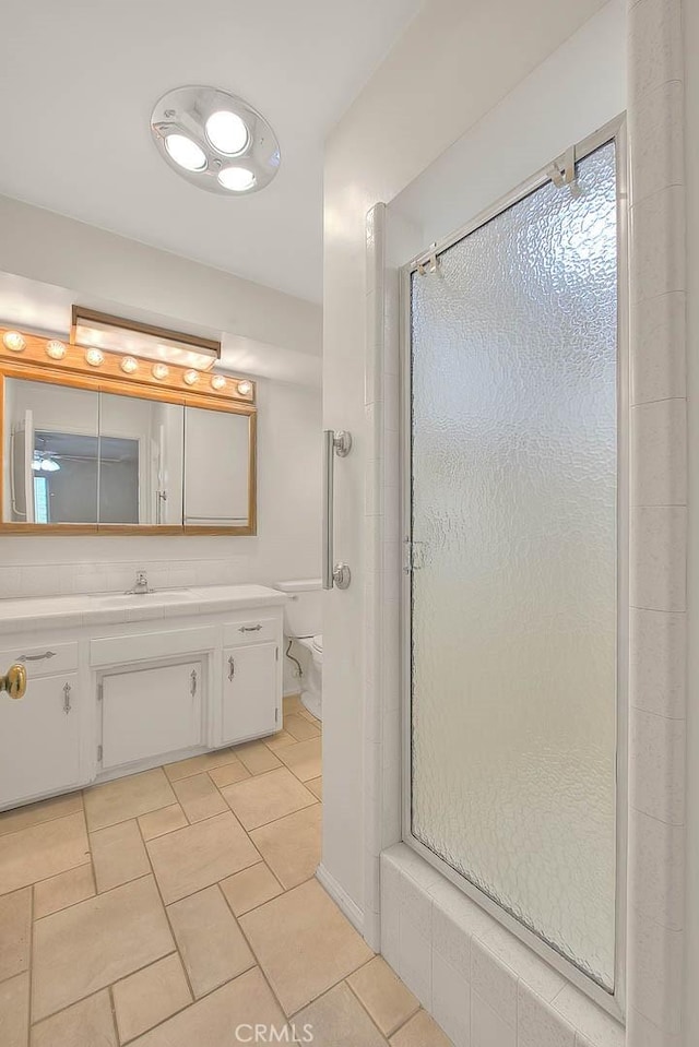9465 Palo Verde Ave, Fontana, CA 92335 - bathroom featuring vanity, a shower stall, and tile patterned flooring