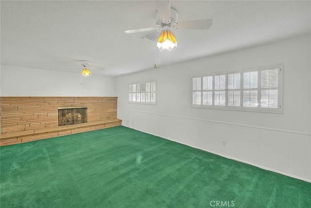 9465 Palo Verde Ave, Fontana, CA 92335 - unfurnished living room with a ceiling fan, carpet floors, a fireplace, and a textured ceiling