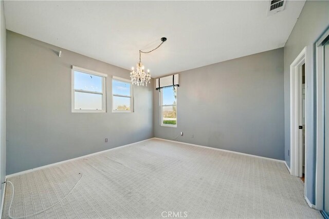 4451 Birdie Dr, Corona, CA 92883 - spare room featuring light colored carpet, a chandelier, and healthy amount of natural light
