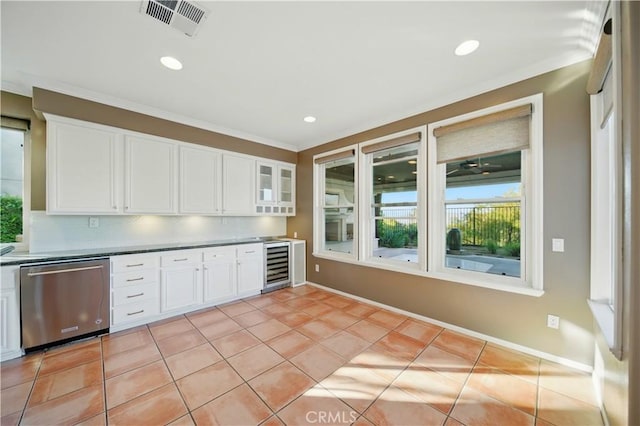 4451 Birdie Dr, Corona, CA 92883 - kitchen with stainless steel dishwasher, beverage cooler, white cabinets, recessed lighting, and crown molding