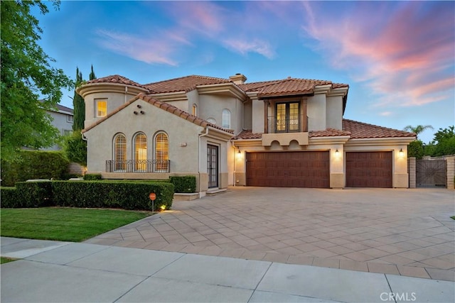 4451 Birdie Dr, Corona, CA 92883 - mediterranean / spanish-style home with french doors, concrete driveway, stucco siding, and an attached garage