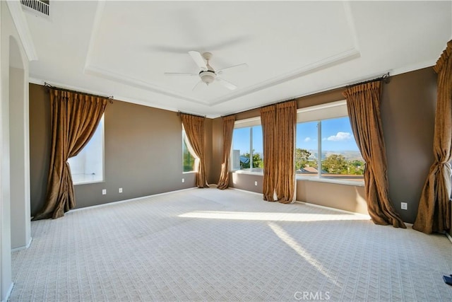 4451 Birdie Dr, Corona, CA 92883 - spare room with a tray ceiling, light carpet, and a ceiling fan