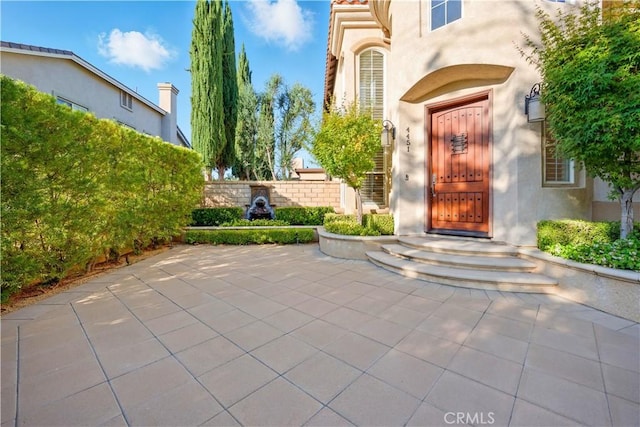 4451 Birdie Dr, Corona, CA 92883 - property entrance with stucco siding