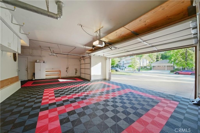 4451 Birdie Dr, Corona, CA 92883 - garage with a garage door opener and freestanding refrigerator
