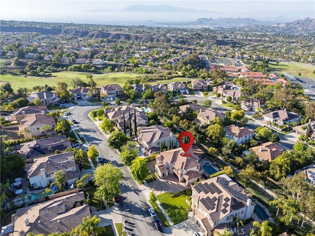 4451 Birdie Dr, Corona, CA 92883 - aerial view of property and surrounding area featuring nearby suburban area, a mountainous background, and a local golf course