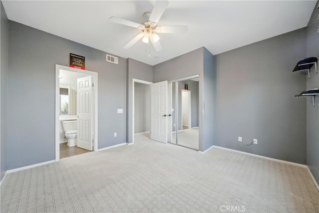 4451 Birdie Dr, Corona, CA 92883 - unfurnished bedroom with carpet, ceiling fan, and ensuite bath