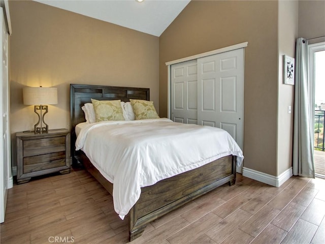 27020 Daisy Cir, Yorba Linda, CA 92887 - bedroom featuring multiple windows, light wood-type flooring, a closet, and high vaulted ceiling