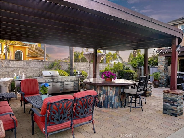 27020 Daisy Cir, Yorba Linda, CA 92887 - patio terrace at dusk featuring a patio and an outdoor kitchen