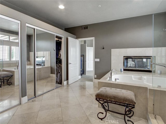 27020 Daisy Cir, Yorba Linda, CA 92887 - bathroom with a garden tub and tile patterned flooring
